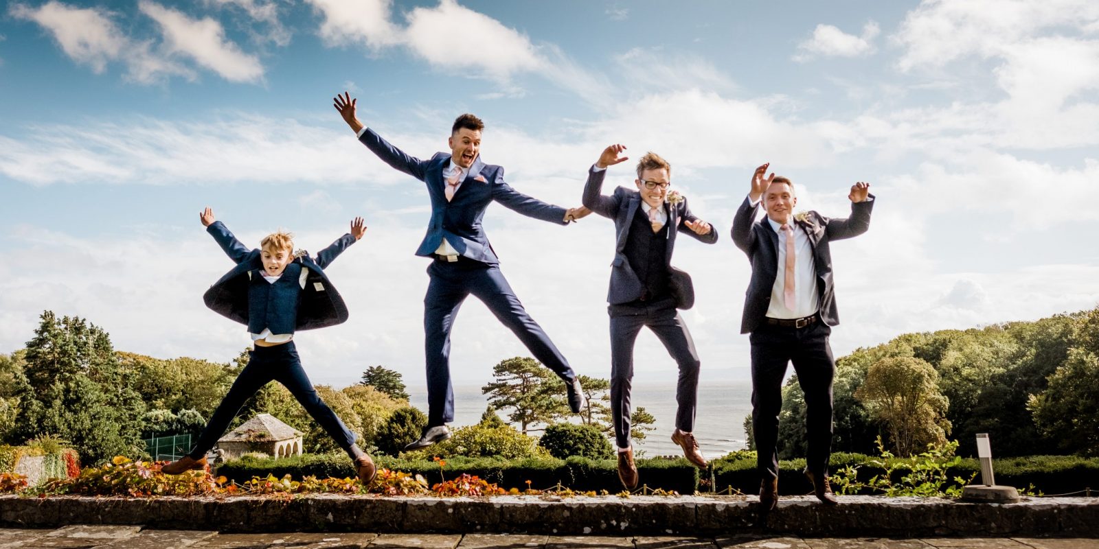 grooms jumping wedding photography