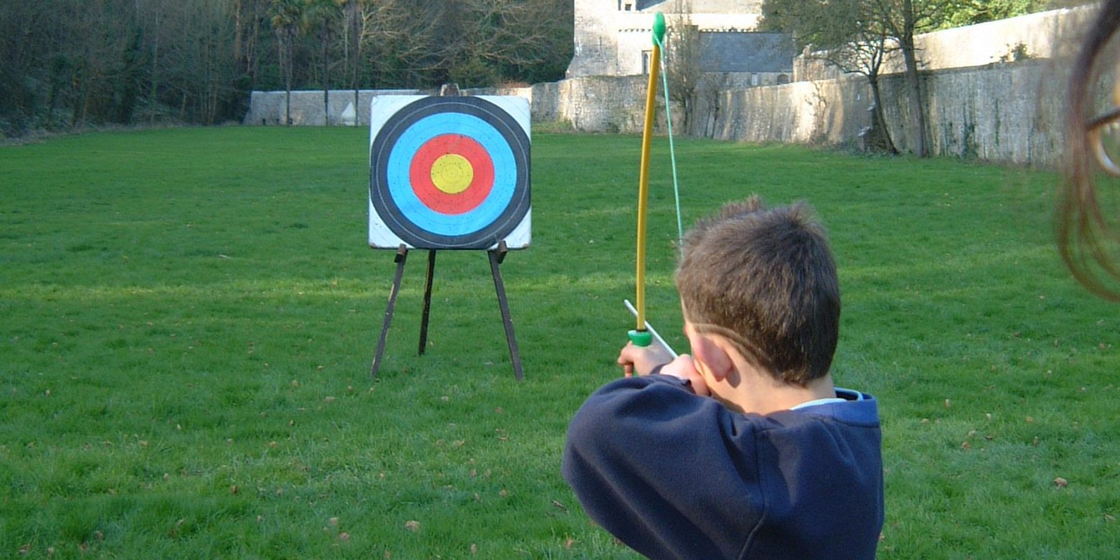 School day trips, child shooting archery