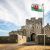 Portcullis entrance to St Donat's Castle with welsh flag flying