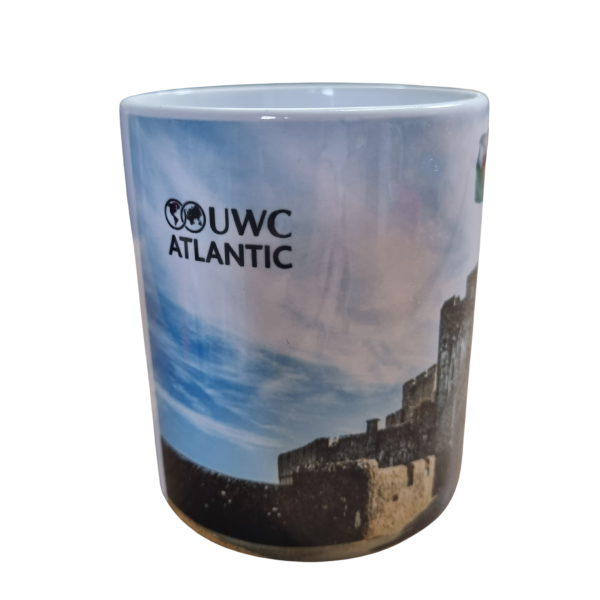 St Donat's Castle mug with photograph of portcullis with Welsh flag flying